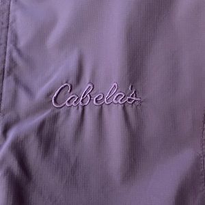 Purple Cabelas rain jacket with hide able hood